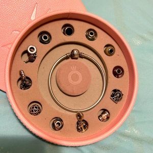 Pandora bracelet, 16 charms and case